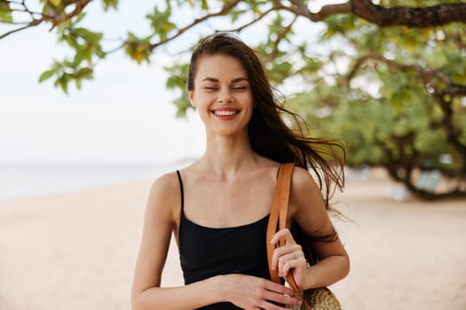 beach woman coast ocean happy smile relax vacation hair sea walk young long sunlight happiness beautiful running dress nature summer sand free