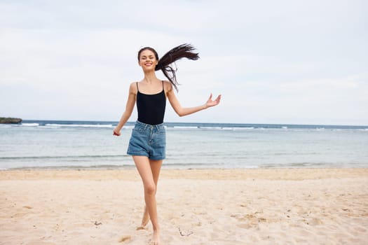 woman hair hair running ocean body bikini sunset beach smiling travel freedom positive long active lifestyle fun sun smile young summer sea