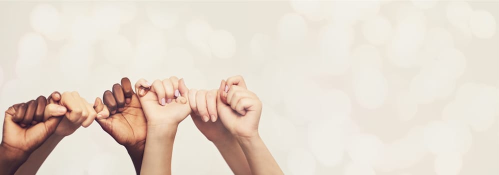 Hands, friends and holding hands with diversity and trust, pinky promise and mockup space on studio background. Team, support and solidarity with bokeh overlay, winning and people with connection.