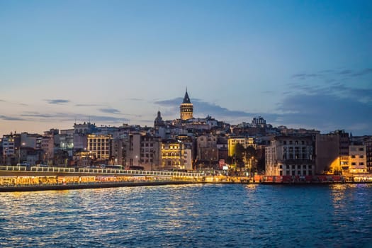 Istanbul city skyline in Turkey, Beyoglu district old houses with Galata tower on top, view from the Golden Horn.