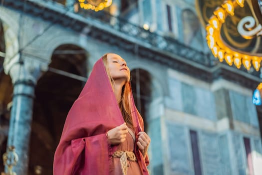Woman tourist enjoying Hagia Sofia, Ayasofya interior in Istanbul, Turkey, Byzantine architecture, city landmark and architectural world wonder. Turkiye.