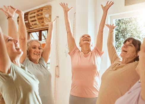 Fitness, success and senior women with their hands up in celebration after yoga or pilates training class. Smile, teamwork and happy elderly friends celebrate wellness goals or target in retirement.