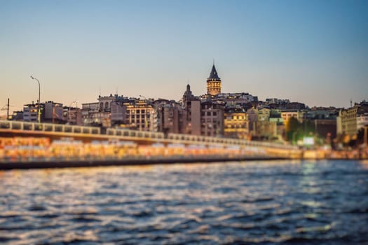 Istanbul city skyline in Turkey, Beyoglu district old houses with Galata tower on top, view from the Golden Horn.