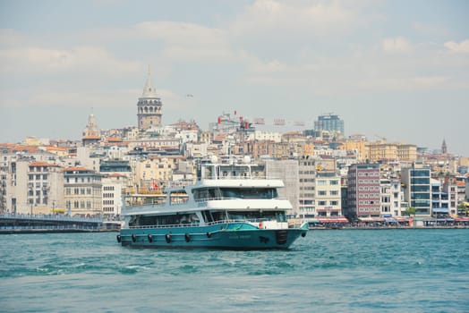 Istanbul, Turkey - May 02, 2023: Traveling along the Bosphorus on the passenger ferry Eminönü. View of the Galata bridge, Galata tower.