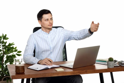handsome man using laptop computer for work at table on white background