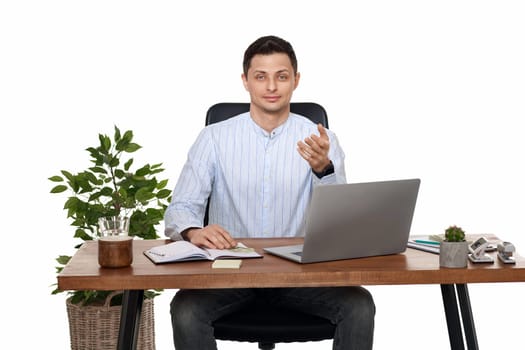smiling businessman using laptop computer for online work at table on white background