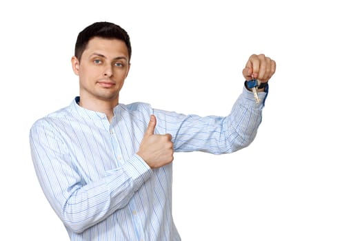 happy caucasian man holding keys on white background.
