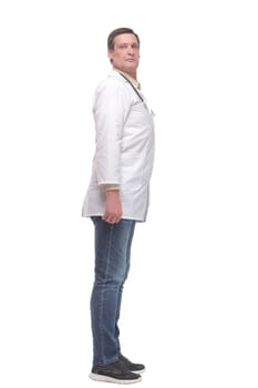Side view full length confident male medical doctor in uniform looking at camera, standing on white background