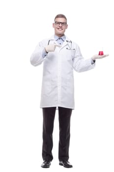 in full growth. smiling doctor with a laboratory flask. isolated on a white background.