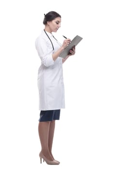 in full growth. female doctor with clipboard. isolated on a white background.