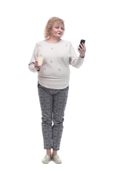 in full growth. casual adult woman with smartphone and takeaway coffee. isolated on a white background.
