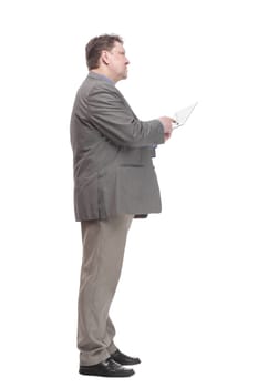 in full growth. business man with a digital tablet. isolated on a white background.