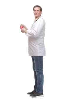 Side view of chemist holding up beaker of red chemical in the laboratory isolated on white background
