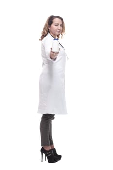 in full growth.serious woman doctor with sanitizer in hand. isolated on a white background.