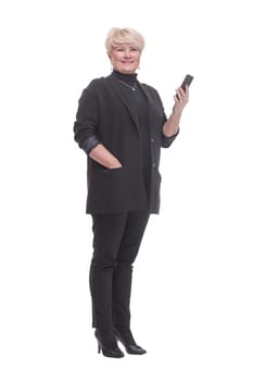 in full growth. business woman looking at the screen of her smartphone. isolated on a white background.