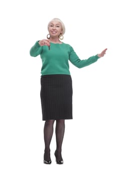 in full growth. smiling woman with keys in her hands. isolated on a white background.