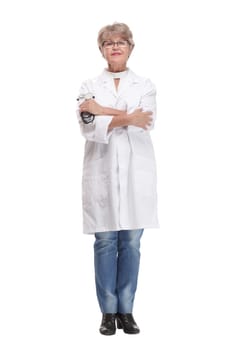 Studio shot of young happy woman doctor holding stethoscope and smiling while pointing finger up
