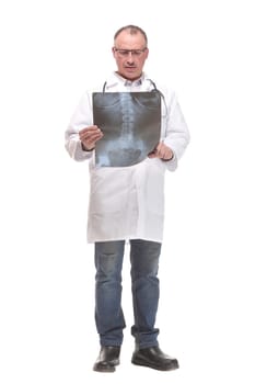 Front view of a doctor with stethoscope studying x-ray image. Isolated on white background