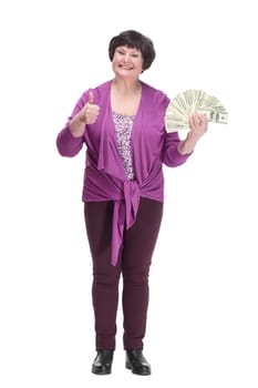 in full growth.happy senior woman with dollar bills. isolated on a white background.