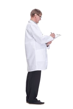 side view. attending doctor is writing recommendations in the clipboard. isolated on a white background.
