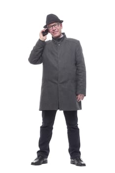 in full growth. intelligent man with a smartphone. isolated on a white background.