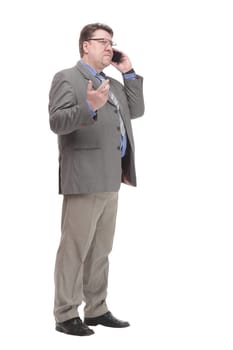 in full growth. serious business man with a smartphone. isolated on a white background.
