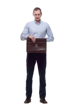in full growth. responsible man with a leather briefcase . isolated on a white background