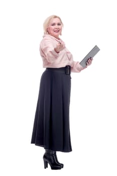 Young adult business woman standing over white background holding clipboard pointing with finger to the camera and to you, hand sign, positive and confident gesture from the front