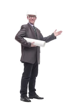 in full growth. business man in a protective helmet with drawings. isolated on a white background.