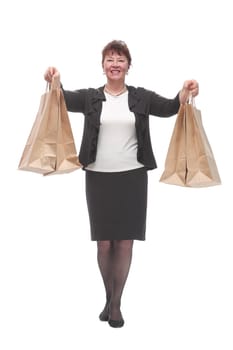 Full isolated portrait of a senior woman with shopping bags happy smiling and looking at camera