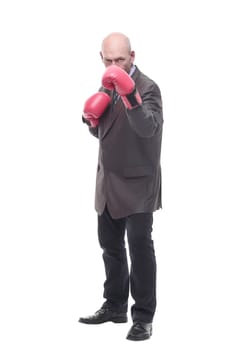 in full growth. business man in Boxing gloves. isolated on a white background.