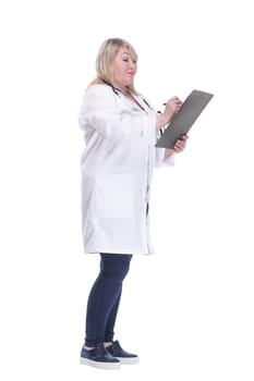side view. serious woman doctor writing a prescription . isolated on a white background.