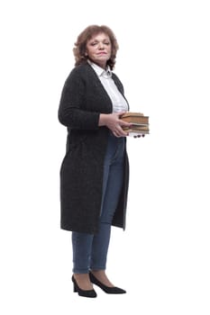 in full growth. a confident woman with a stack of books. isolated on a white background