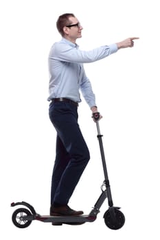 side view. casual man with electric scooter looking at you. isolated on a white