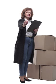in full growth. serious woman signs documents after delivery. isolated on a white background