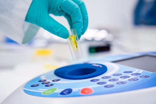 Insert the cuvette into the spectrophotometer for DNA, microbiological or urinanalysis analysis.