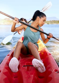 Lake, friends and kayak adventure with water sport on travel trip canoeing, kayaking and using paddle on calm nature river. Exercise, vacation or holiday with women enjoying boat activity in summer.