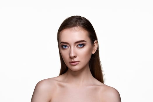 portrait of beautiful young woman with perfect skin on white background. copy space