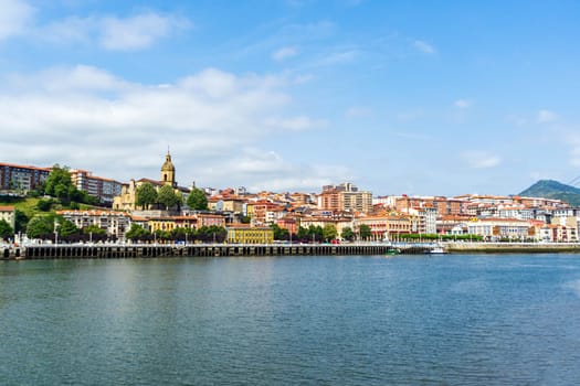 View of Portugalete town by Nervion river, and Sandra Maria basilica, Basque Country, Spain