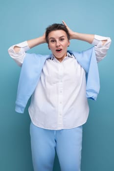 portrait of surprised charismatic young millennial woman with short haircut.