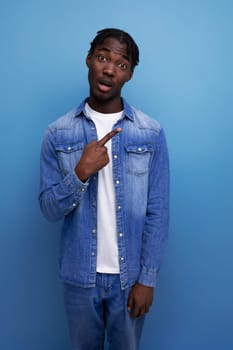 portrait of an african man with curly hair in a casual look.