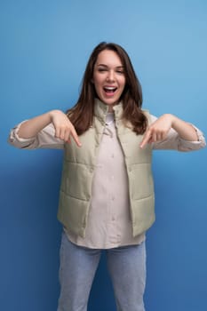 emotional cheerful black-haired young lady in casual clothes reports an idea that has arisen in her head on an isolated background.