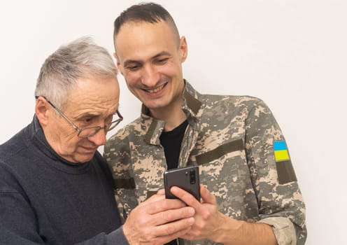 Ukrainian military man with his father.