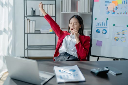 Rear view young businesswoman leaning back in comfortable chair, sitting in modern office, successful woman employee, planning future, visualizing, pondering project strategy