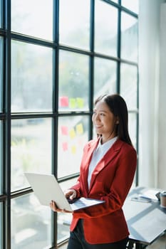 Business, finance and employment, female successful entrepreneurs concept. Confident smiling asian businesswoman, using laptop at work