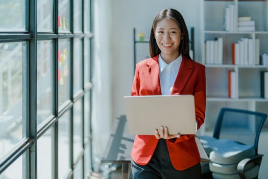 Business, finance and employment, female successful entrepreneurs concept. Confident smiling asian businesswoman, using laptop at work