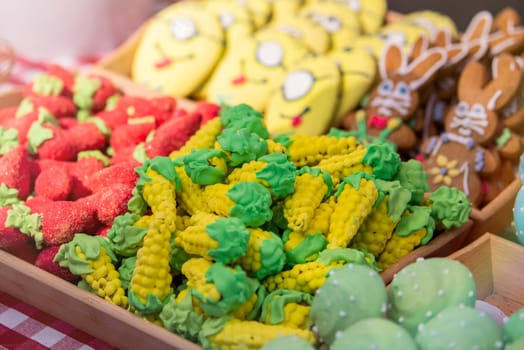 Sweet pastries with rainbow icing in a pastry shop. High quality photo