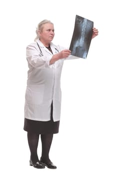 Front view of medical doctor analysing x-ray image looking at camera and smiling