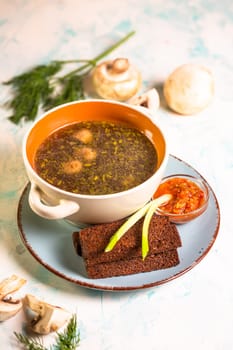 mushroom soup with toast in a cafe on the table.