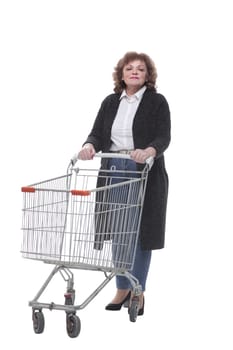 in full growth. casual woman with shopping cart. isolated on a white background